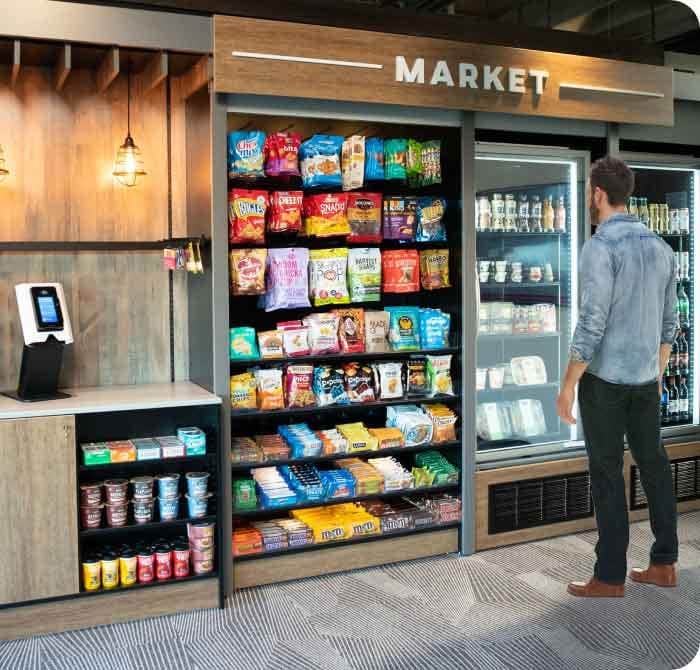 Open-shelf micro market with self-checkout kiosk and refrigerated cooler